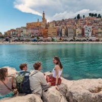 family looking at the beautiful town of menton, alpes-maritimes, france. - travel stock pictures, royalty-free photos & images