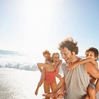 family playing at the beach - travel stock pictures, royalty-free photos & images