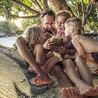 family relaxing in hammock. - travel stock pictures, royalty-free photos & images