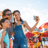 family taking a selfie on the tropical beach - travel stock pictures, royalty-free photos & images