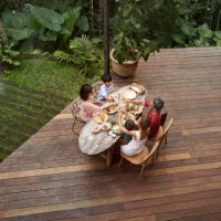 family toasting drinks on porch at resort - home decoration stock pictures, royalty-free photos & images