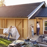 family using hammer on walls of house being renovated - home decoration stock pictures, royalty-free photos & images