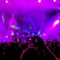 fan taking cell phone photograph of music stage - concert stock pictures, royalty-free photos & images