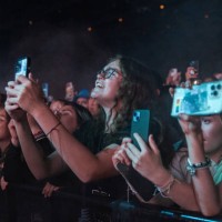 Fans cheer as singer Melanie Martinez performs onstage during the