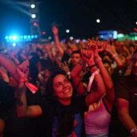 Fans enjoy the Senegalese-American singer Akon's concert during the Rock in Rio music festival in the Rio 2016 Olympic Park in Rio de Janeiro,...