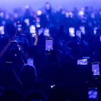 Fans hold up their phones and record as Kehlani performs onstage at Byline Bank Aragon Ballroom on September 06, 2024 in Chicago, Illinois.