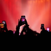 Fans holding their mobile phones high in the air to record gig at O2 Academy Bournemouth on March 09, 2023 in Bournemouth, England.