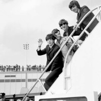 Fans line the rooftop at Kennedy International Airport for a last glimpse of the Beatles -- Paul McCartney, Ringo Starr, John Lennon, and George...
