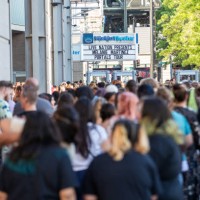 Fans line up outside for the Melanie Martinez concert during the 
