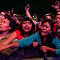 Fans of Canadian singer Justin Bieber cry during a concert at the Zocalo square, in Mexico City, on June 11, 2012. AFP PHOTO / RONALDO SCHEMIDT