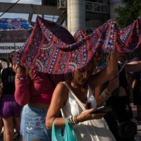 Fans of US singer Taylor Swift queue outside the Nilton Santos Olympic Stadium before Swift's concert, 