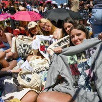 Fans show Taylor Swift t-shirts as they camp waiting outside the premises where hundreds of people are already queuing to get into Lisbon's Estádio...