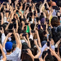 Fans use their phones as South Korean girl band Aespa performs as part of ABCs Good Morning America 2022 summer concert series at Central Park in New...