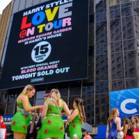 Fans wearing themed outfits take photos outside Madison Square Garden before the Harry Styles Love On Tour 2022 concert on August 21, 2022 in New...