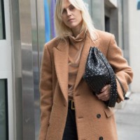 Fashion blogger Linda Tol wears a Salle Privee coat, Valentino bag and MSGM sweater day 6 of Paris Womens Fashion Week Spring/Summer 2018, on October...