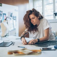 fashion designer pinning fabric cutouts - fashion stock pictures, royalty-free photos & images