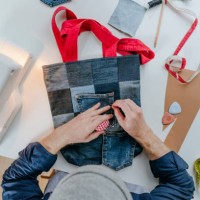 fashion designer stitching pocket on shopping bag - fashion stock pictures, royalty-free photos & images