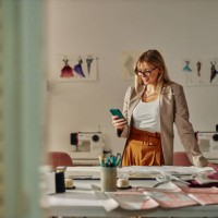 fashion designer typing message to client - fashion stock pictures, royalty-free photos & images