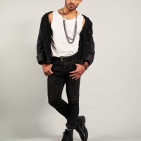 fashion, model and man from mexico in a studio posing for a luxury clothes brand. portrait of a gen z, tough and cool look and pose of a young male person in rich designer style clothing for trends - fashion stock pictures, r