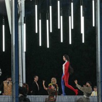 Fashion model displays creations while walking a catwalk erected along the Passerelle Debilly bridge on the Seine river during the opening ceremony...