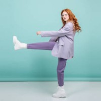 fashion model makes a step posing on a colored background with copy space. fashion and trend concept - fashion stock pictures, royalty-free photos & images