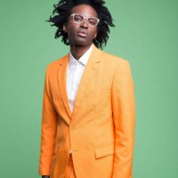 fashion portraot of elegant man in orange suit - fashion stock pictures, royalty-free photos & images