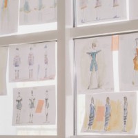 fashion projects hanging on a window. designer's studio - fashion stock pictures, royalty-free photos & images