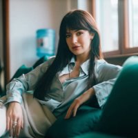 fashionable businesswoman sitting in the modern start-up office - hairstyle stock pictures, royalty-free photos & images