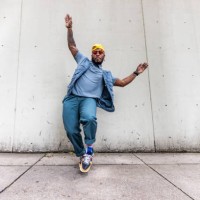 fashionable male professional dancer on urban sidewalk, full length - fashion stock-fotos und bilder