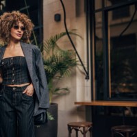 fashionable woman enjoying coffee in the city - fashion stock pictures, royalty-free photos & images