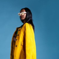 fashionable woman in a yellow coat - fashion stock pictures, royalty-free photos & images