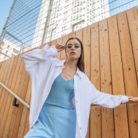 fashionable woman in glasses looking at the camera in trendy fashionable clothes outdoors on a city street. fashion and sale concept - fashion stock pictures, royalty-free photos & images