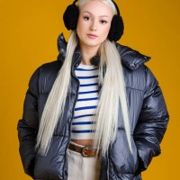 fashionable woman in puffy winter coat - fashion stock pictures, royalty-free photos & images