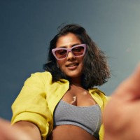 fashionable woman taking selfie against sky - fashion stock pictures, royalty-free photos & images