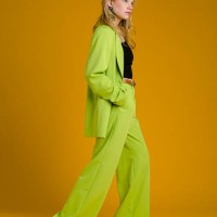 fashionable woman wearing green suit - fashion stock pictures, royalty-free photos & images