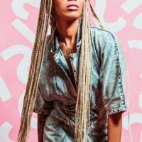 fashionable woman with long braids wearing acid wash denim dress late 1980s style, early 1990s style - fashion stock pictures, royalty-free photos & images