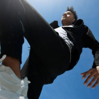 fashionable young man against blue sky on sunny day - fashion stock pictures, royalty-free photos & images