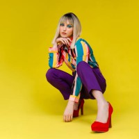 fashionable young woman in colorful outfit - fashion stock pictures, royalty-free photos & images