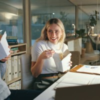 fast food, delivery and business women at night in office with computer, project and happy, working and deadline. working late, noodles and female friends laughing on work break for dinner or meal - junk food stock pictures, 