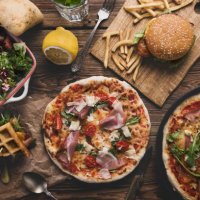 fast food on old wooden background. - junk food stock pictures, royalty-free photos & images