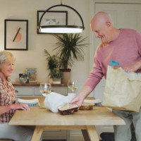 fast food, takeaway and senior couple with dinner at table for eating lunch, supper or meal together. marriage, retirement and elderly man and woman with takeout for hunger, bonding and relaxing - junk food stock pictures, ro