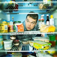 fat man raiding the refrigerator - junk food stock pictures, royalty-free photos & images
