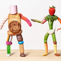 fat sweet man and thin vegetable man - junk food stock pictures, royalty-free photos & images