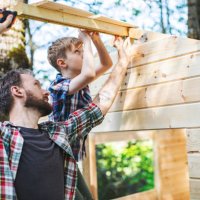 father and son building tree house at backyard - home decoration stock pictures, royalty-free photos & images