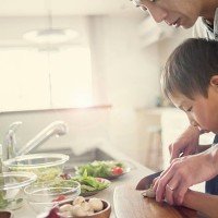 father and son cooking together at home - food stock pictures, royalty-free photos & images