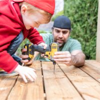 father and son doing a construction project while in quarantine - home decoration stock pictures, royalty-free photos & images