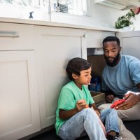 father and son doing home improvement project - home decoration stock pictures, royalty-free photos & images