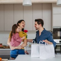 father bring food from restaurant, having diner with wife and daughter at home. family moment after long work day. - junk food stock pictures, royalty-free photos & images