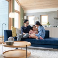 father relaxing with his daughters on the sofa - home decoration stock pictures, royalty-free photos & images