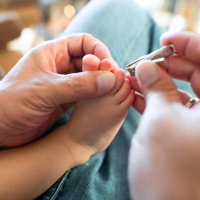 father taking care of his baby girl - nails art stock pictures, royalty-free photos & images